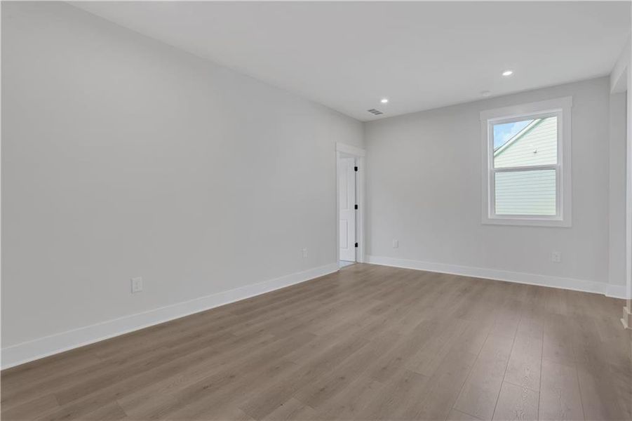 Spacious, unfurnished interior of a new home in The Paddocks at Doc Hughes, Buford (Image 25).