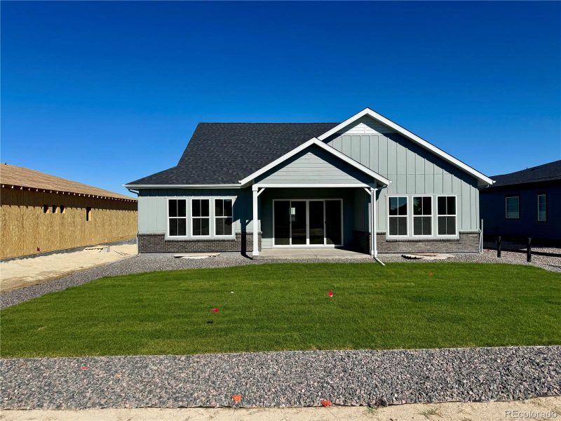 Exterior details and patio area of a home in Hilltop at Inspiration, Aurora (Image 31).