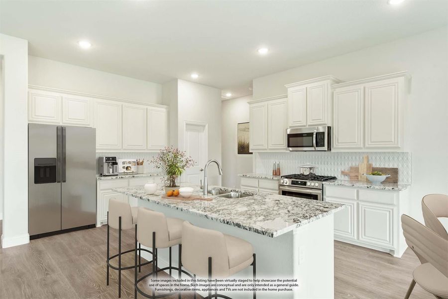 Kitchen with white cabinets, granite island with seating, and stainless steel appliances on wood floors Kitchen with white cabinets, granite island with seating, and stainless steel appliances on wood floors