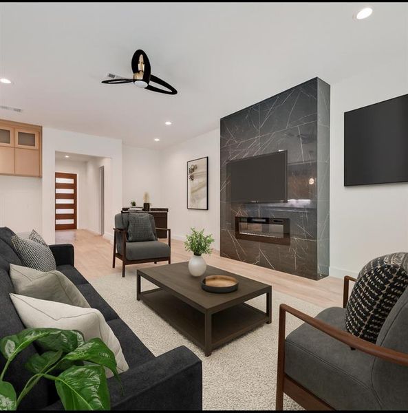 Living room featuring recessed lighting and light wood finished floors