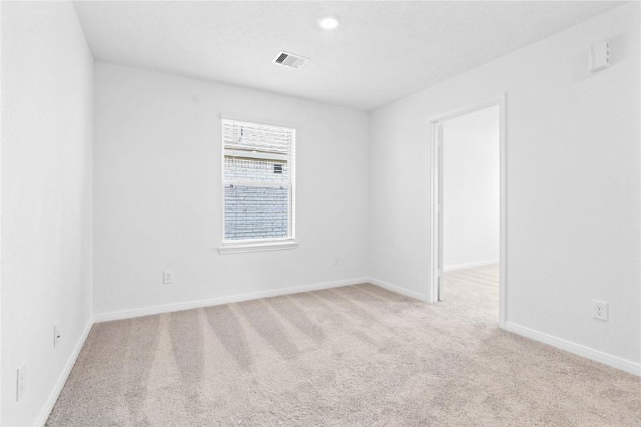 Head upstairs and enjoy the Loft—an additional living area perfect for a game room, media space, or a peaceful retreat. Featuring plush carpet, neutral paint, large window with blinds, and high ceilings with recessed lighting. Head upstairs and enjoy the Loft—an additional living area perfect for a game room, media space, or a peaceful retreat. Featuring plush carpet, neutral paint, large window with blinds, and high ceilings with recessed lighting.