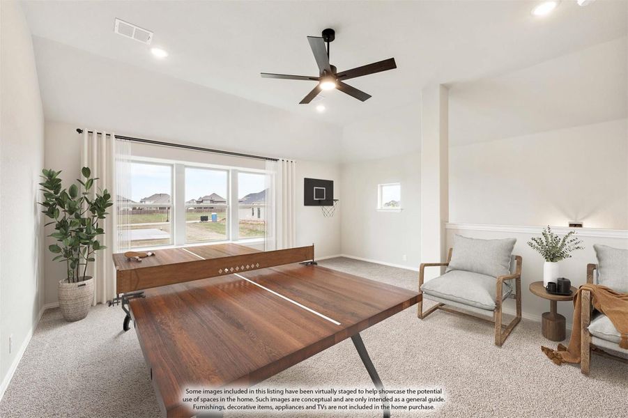 Game room with ping pong table, ceiling fan, carpet flooring, and wall-mounted basketball hoop Game room with ping pong table, ceiling fan, carpet flooring, and wall-mounted basketball hoop