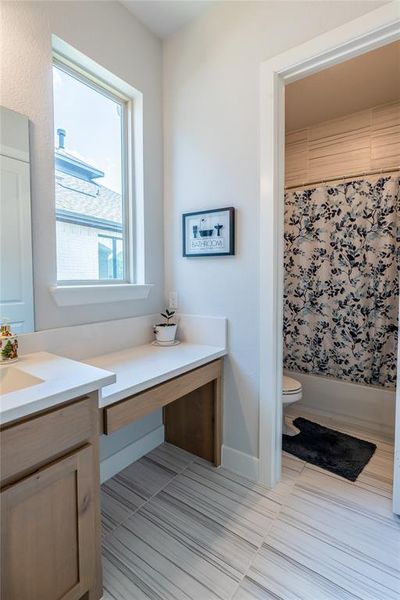 Bedroom with carpet flooring and lofted ceiling