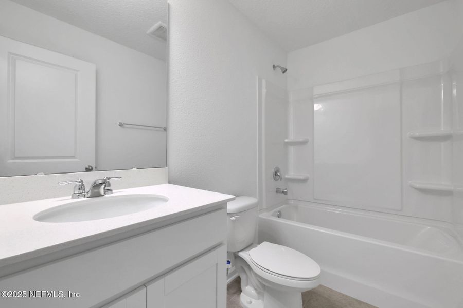 Furnished interior view inside a new home in Atlantis Pointe, Middleburg (Image 6).