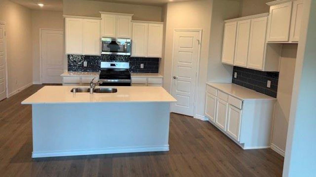 Furnished interior view inside a new home in Fireside by the Lake, Garland (Image 6).