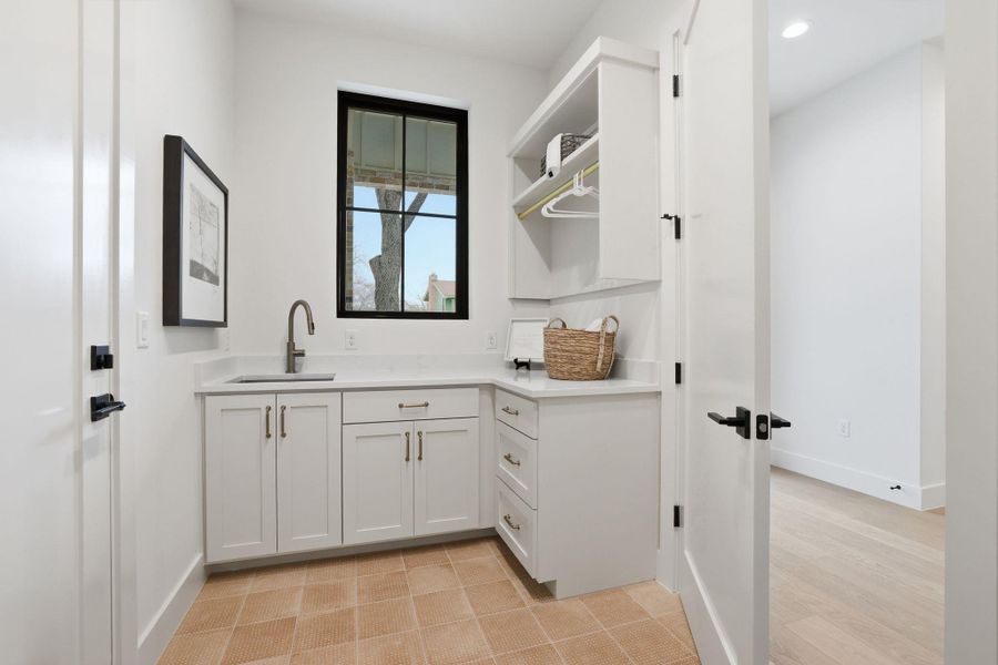 Bar with open shelves and white cabinetry