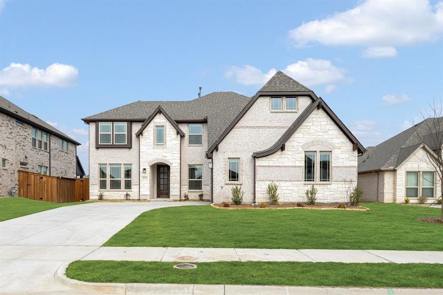 Front exterior of a new home in Terracina, Rockwall, TX, highlighting curb appeal (Image 22). Front exterior of a new home in Terracina, Rockwall, TX, highlighting curb appeal (Image 22).