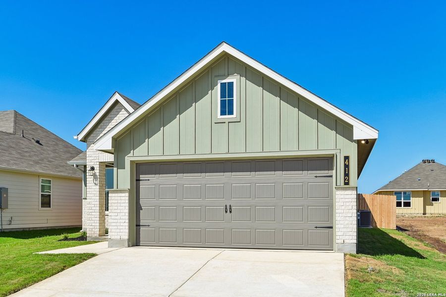 Front exterior of a new home in Arroyo Ranch, Seguin, TX, highlighting curb appeal (Image 22).