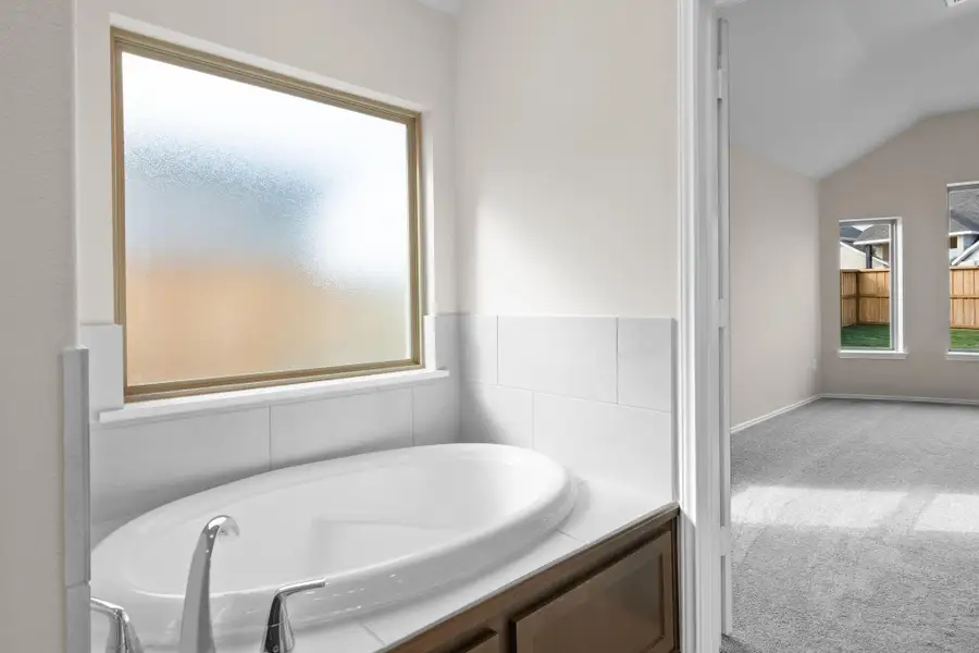 Furnished interior view inside a new home in Dunham Pointe 50', Cypress (Image 11).