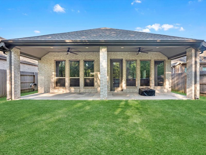 Exterior details and patio area of a home in Artavia 45', Conroe (Image 2). Exterior details and patio area of a home in Artavia 45', Conroe (Image 2).