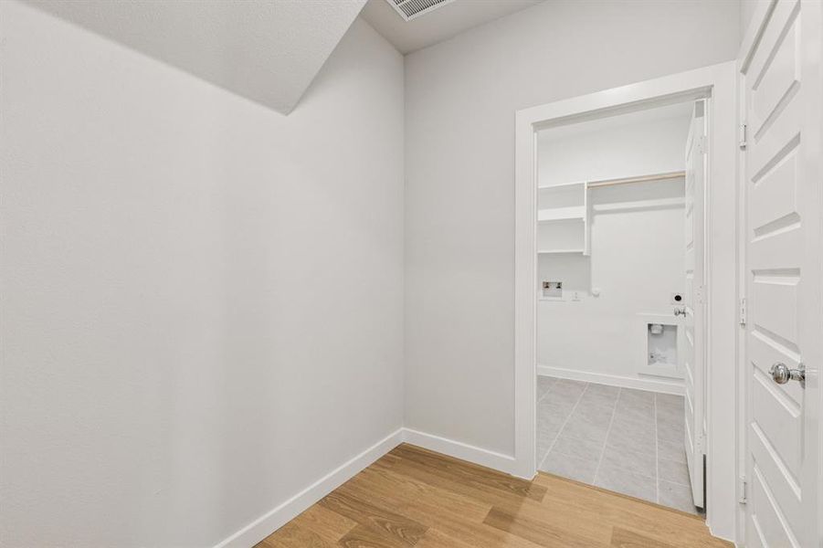 Utility Room in the Winters home plan by Trophy Signature Homes – REPRESENTATIVE PHOTO