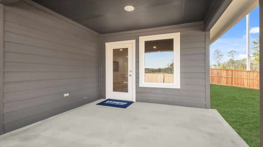 Exterior details and patio area of a home in New Waverly Station, New Waverly (Image 3).