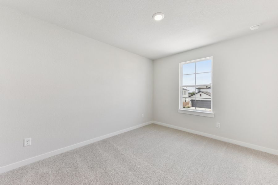 A room with a window and a light on the wall. A room with a window and a light on the wall.