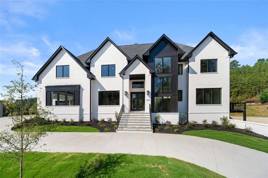 Front exterior of a new home in Timber Rock Manor, Cumming, GA, highlighting curb appeal (Image 30).