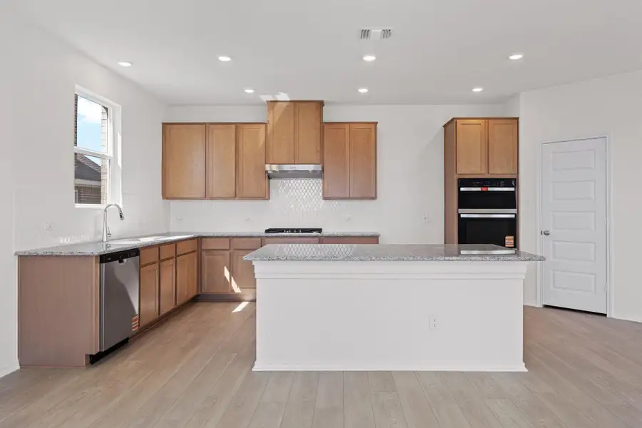 Furnished interior view inside a new home in Salerno - Classic Collection, Round Rock (Image 9). Furnished interior view inside a new home in Salerno - Classic Collection, Round Rock (Image 9).