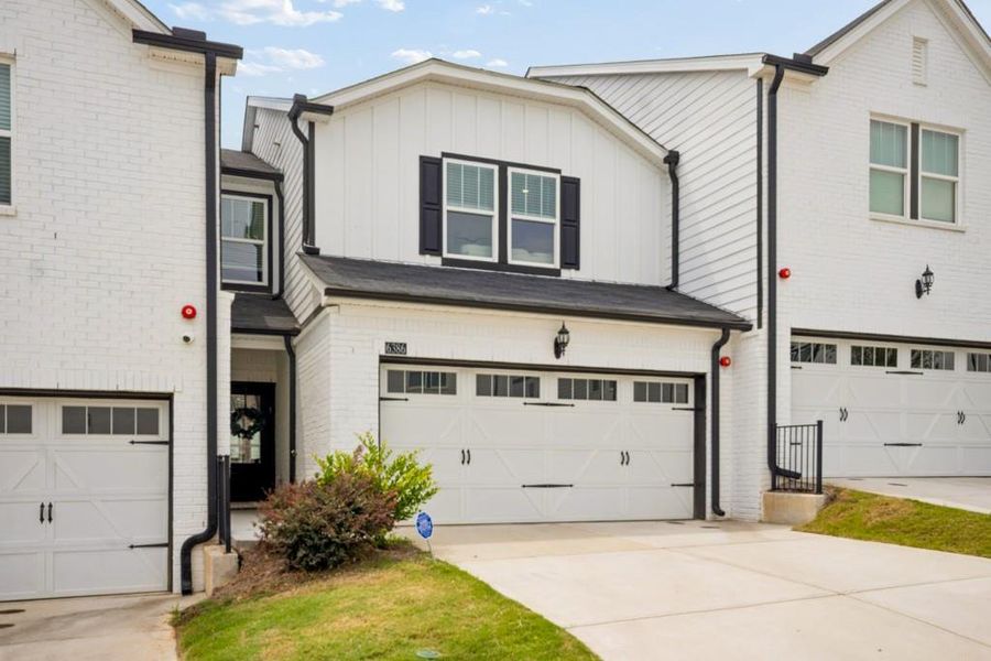Front exterior of a new home in Brooks at Riverview Landing, Smyrna, GA, highlighting curb appeal (Image 22). Front exterior of a new home in Brooks at Riverview Landing, Smyrna, GA, highlighting curb appeal (Image 22).