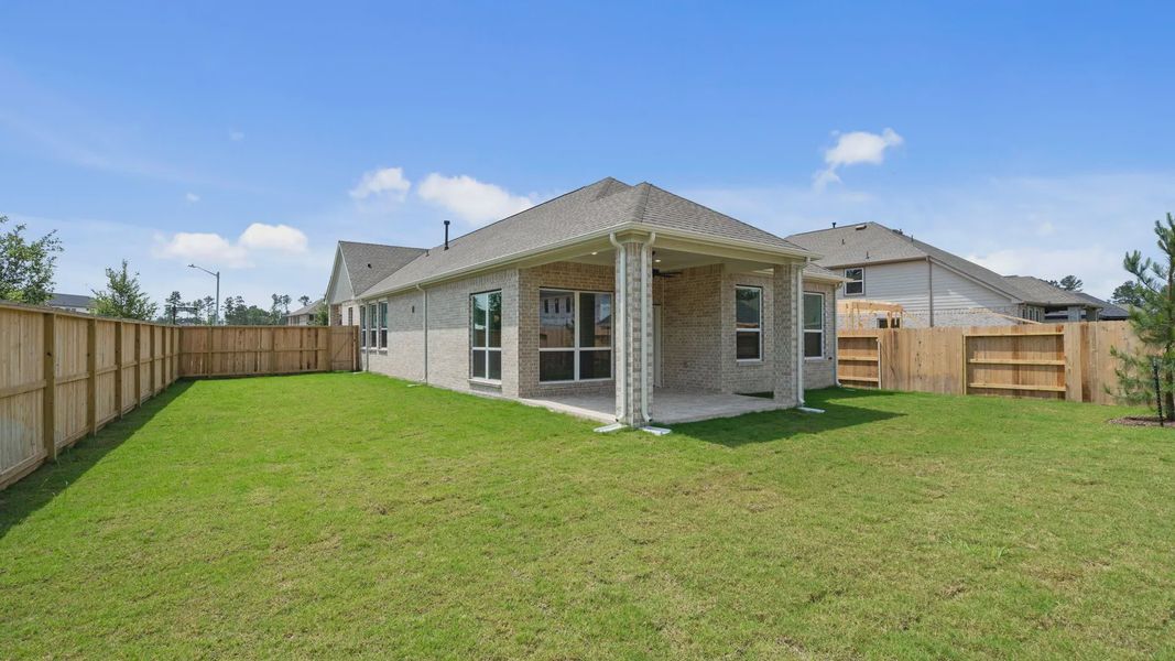 Exterior details and patio area of a home in Evergreen 40s, Conroe (Image 4). Exterior details and patio area of a home in Evergreen 40s, Conroe (Image 4).