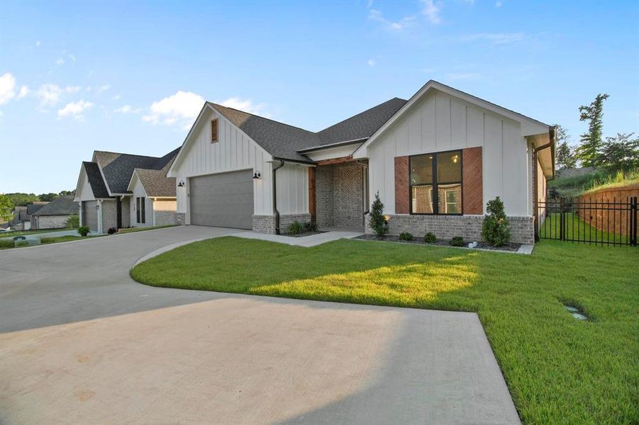 Front exterior of a new home in , Tyler, TX, highlighting curb appeal (Image 23). Front exterior of a new home in , Tyler, TX, highlighting curb appeal (Image 23).