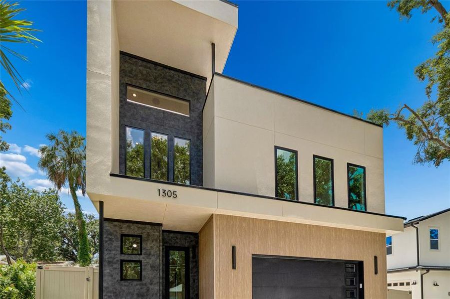 Front exterior of a new home in , Tampa, FL, highlighting curb appeal (Image 34).