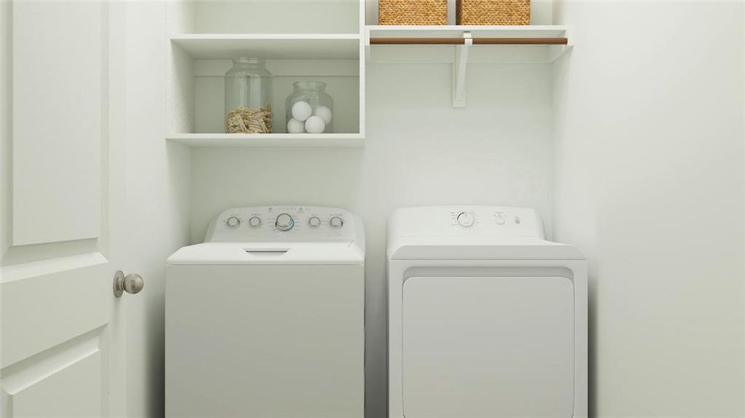 Laundry room featuring washer and clothes dryer