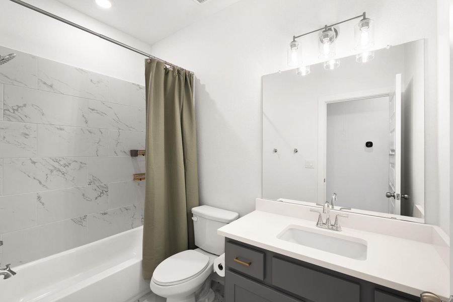 A well-appointed bathroom with a sleek vanity and modern fixtures for daily rejuvenation.