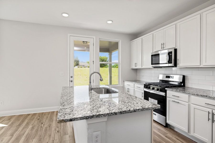 Representative furnished interior of a home built from the Atkinson by UnionMain Homes in Austin Springs, Bethlehem (Image 9).