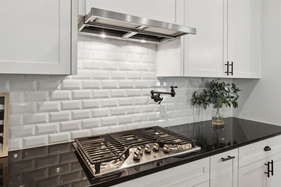 Pot filler and gorgeous tile backsplash