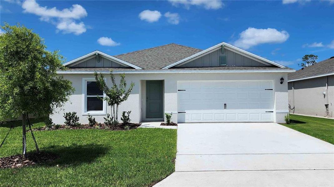 Front exterior of a new home in , Ormond Beach, FL, highlighting curb appeal (Image 1). Front exterior of a new home in , Ormond Beach, FL, highlighting curb appeal (Image 1).