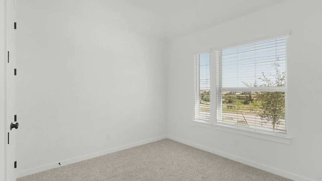 Representative unfurnished interior of a home built from the Brooks by Chesmar Homes in University Heights, Round Rock (Image 19).
