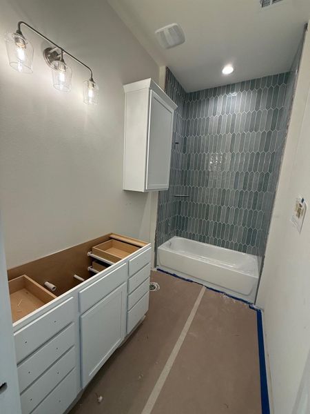 Bathroom featuring shower / bath combination and vanity