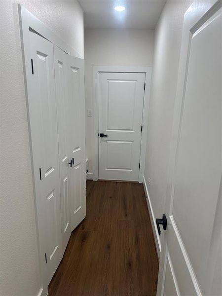 Laundry area, door leads to garage.