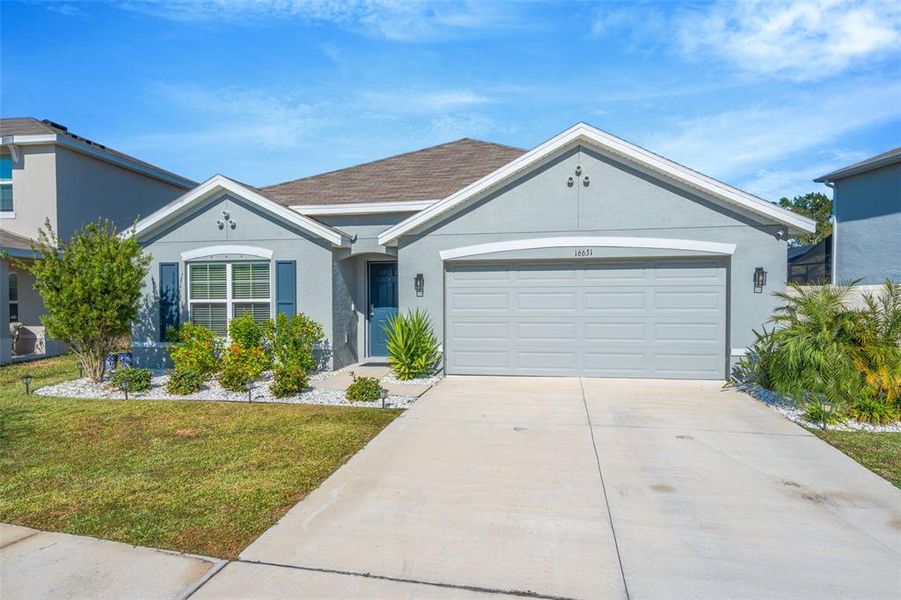 Front exterior of a new home in Sereno, Wimauma, FL, highlighting curb appeal (Image 2).