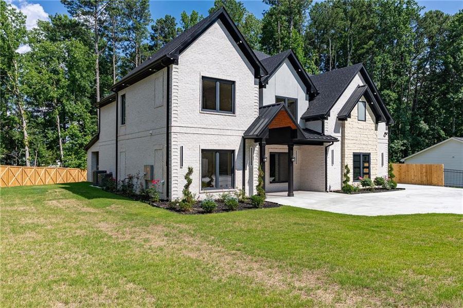 Front exterior of a new home in , Lawrenceville, GA, highlighting curb appeal (Image 45). Front exterior of a new home in , Lawrenceville, GA, highlighting curb appeal (Image 45).