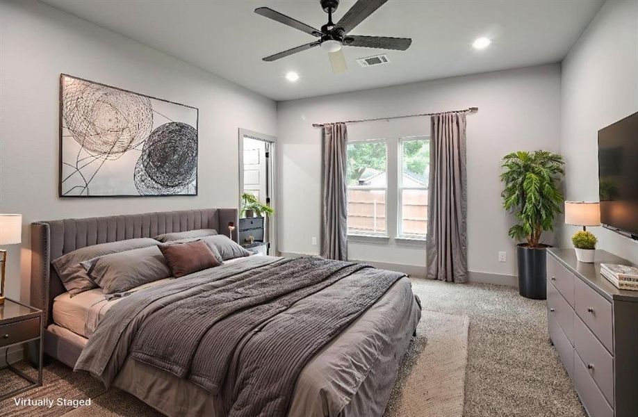 Bedroom with light carpet, ceiling fan, and recessed lighting Bedroom with light carpet, ceiling fan, and recessed lighting
