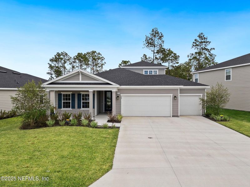 Front exterior of a new home in Seminole Palms Single-Family Homes, Palm Coast, FL, highlighting curb appeal (Image 2).