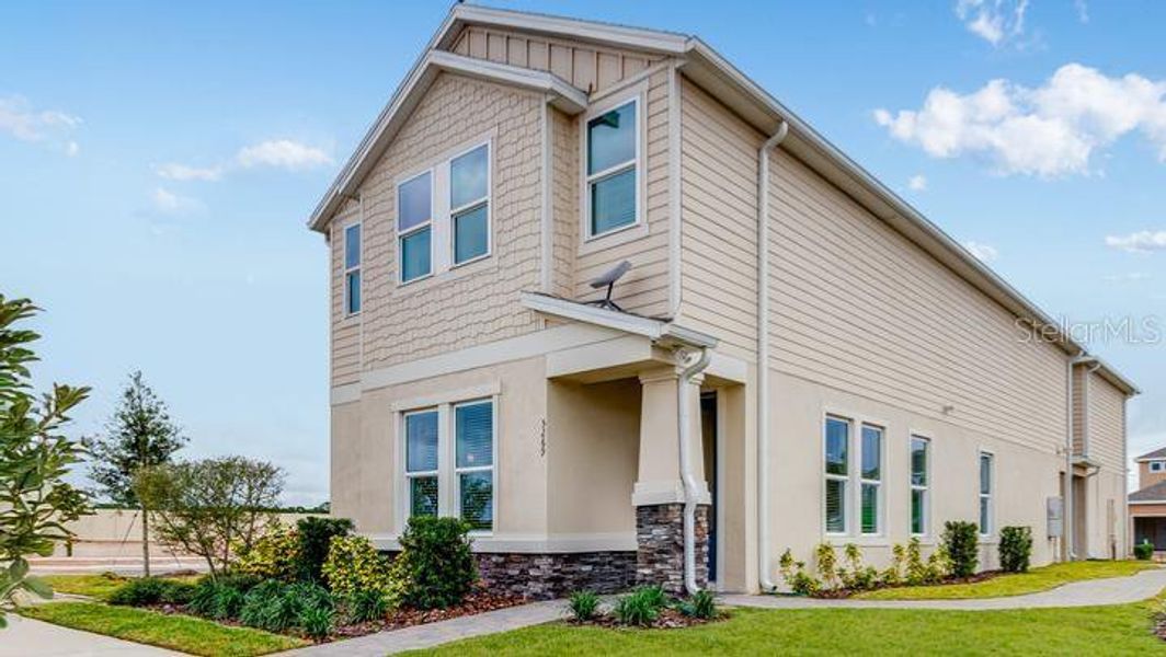 Front exterior of a new home in Center Lake Ranch Community Group Page, St. Cloud, FL, highlighting curb appeal (Image 16).