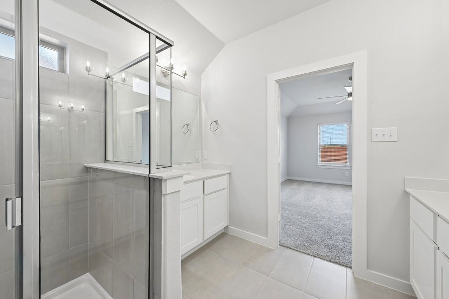 Primary Bathroom in the Heisman home plan by Trophy Signature Homes Primary Bathroom in the Heisman home plan by Trophy Signature Homes