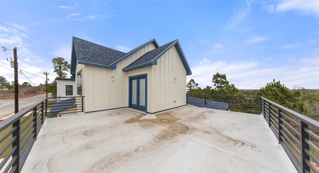 View of outdoor structure with a patio