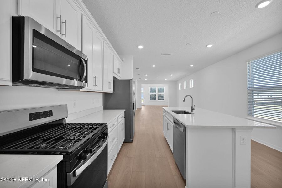 Furnished interior view inside a new home in Del Webb Wildlight, Yulee (Image 4).
