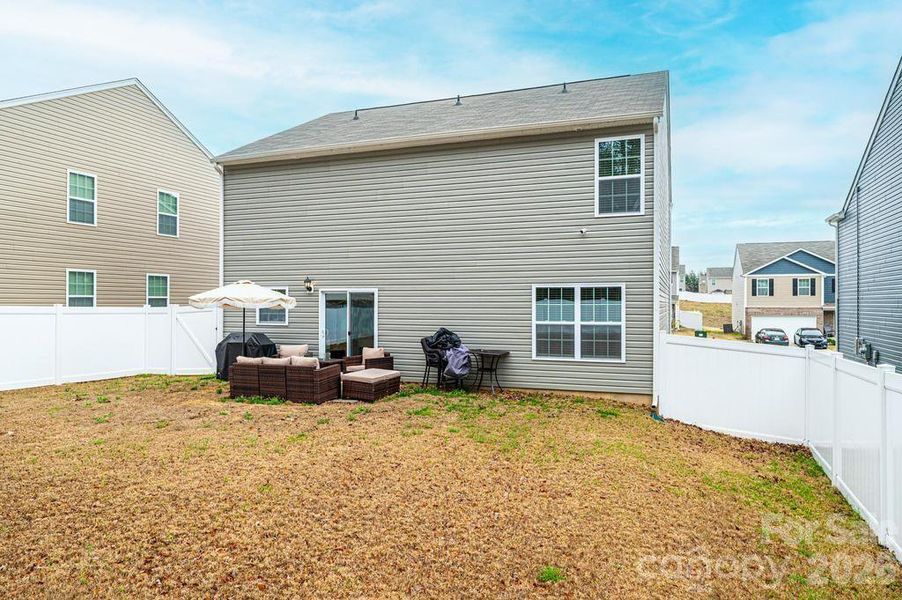 Exterior details and patio area of a home in Mills at Long Creek, Dallas (Image 28).