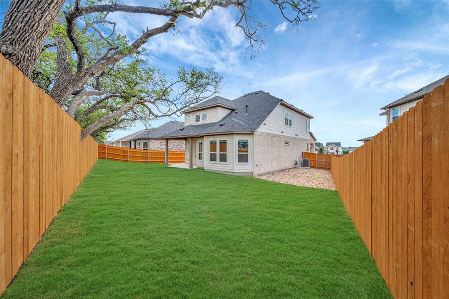 Exterior details and patio area of a home in Heritage, Dripping Springs (Image 13).