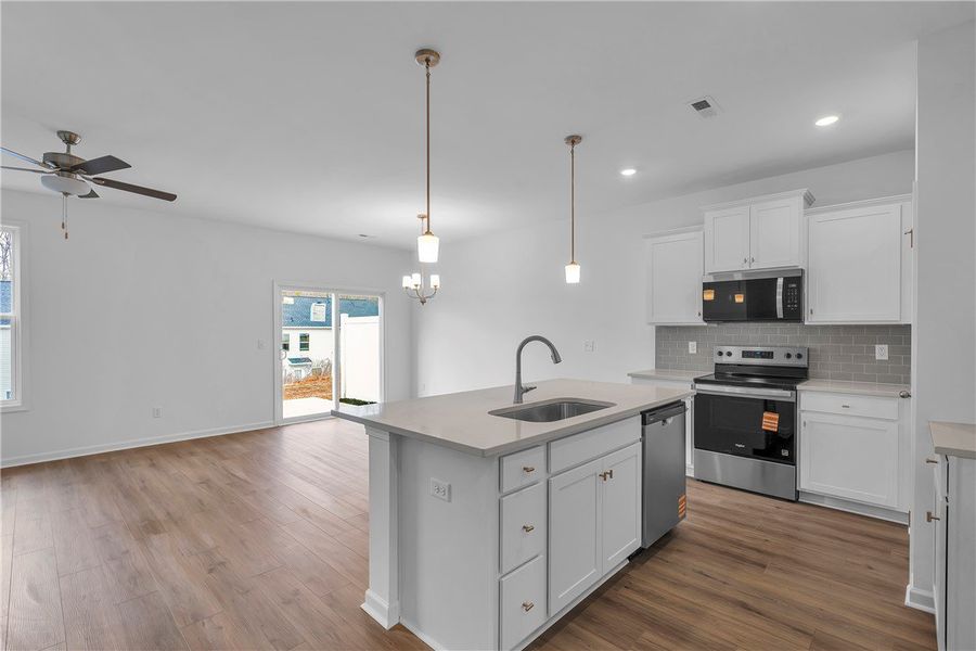 An inviting open-concept kitchen and living area, An inviting open-concept kitchen and living area,