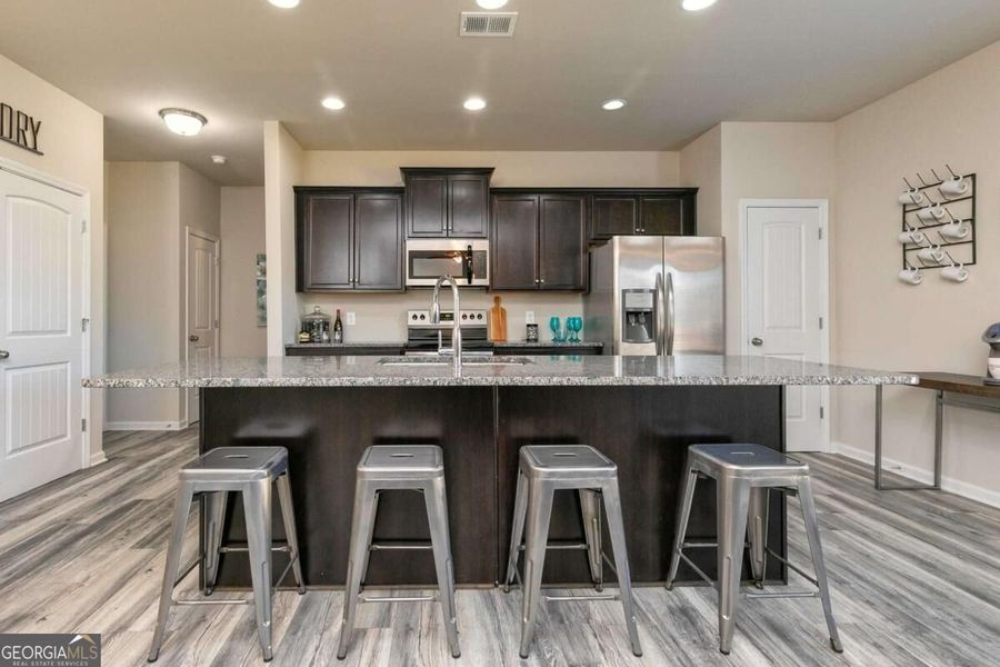 Furnished interior view inside a new home in Cobblestone Crossing Commons, Byron (Image 14).
