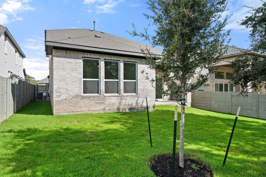 Exterior details and patio area of a home in Wolf Ranch, Georgetown (Image 26).