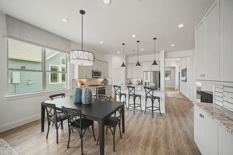 Representative furnished interior of a home built from the Athens by Chesmar Homes in Sunterra, Katy (Image 9).