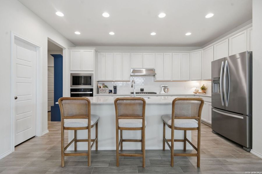 Furnished interior view inside a new home in Bison Ridge, San Antonio (Image 28).
