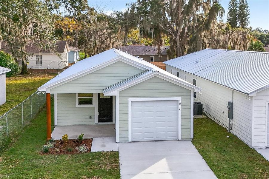 Front exterior of a new home in , Eustis, FL, highlighting curb appeal (Image 2). Front exterior of a new home in , Eustis, FL, highlighting curb appeal (Image 2).
