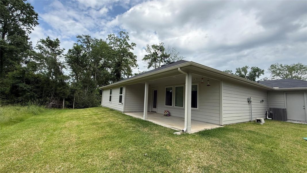 Exterior details and patio area of a home in , Conroe (Image 3).