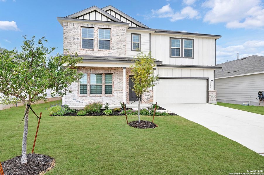 Front exterior of a new home in Winding Brook, San Antonio, TX, highlighting curb appeal (Image 20).