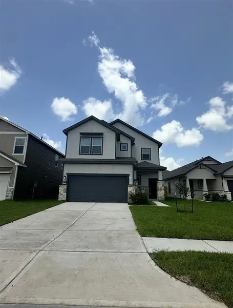 Front exterior of a new home in Glendale Lakes, Arcola, TX, highlighting curb appeal (Image 1).